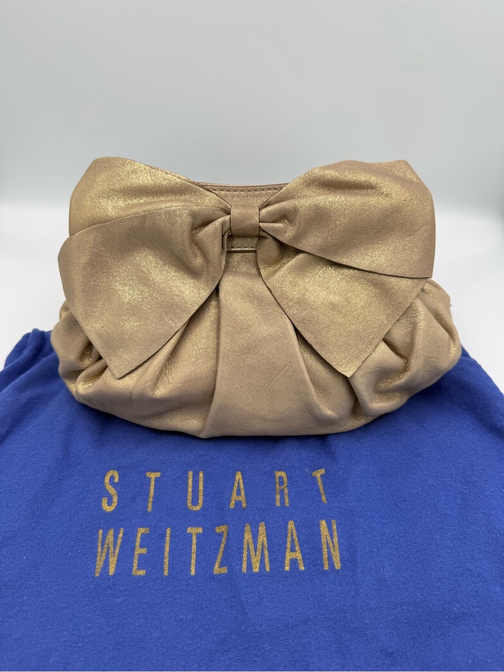 Stuart Weitzman Metallic Gold Bow Wristlet Clutch